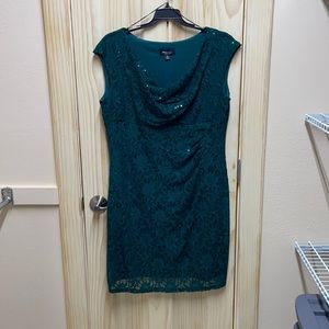 Emerald green cocktail length dress.